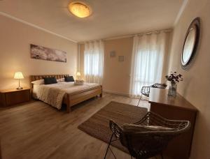 a bedroom with a bed and a table and a mirror at Lago Idro Glamping Boutique in Anfo +44 photos
