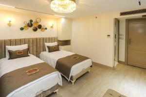 Postel nebo postele na pokoji v ubytování Safa Hotel Old City