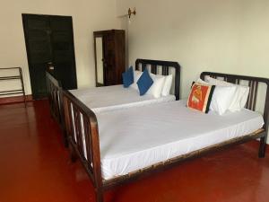 Letto o letti in una camera di Kandy Siebel Bungalow
