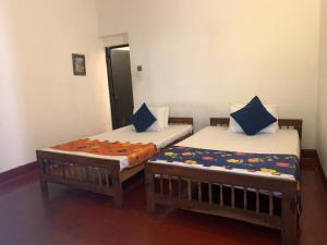 Letto o letti in una camera di Kandy Siebel Bungalow