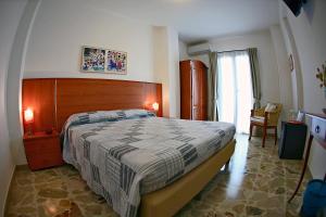 A bed or beds in a room at B&B La Veduta