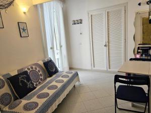 a living room with a couch and a table at Maridea - O'Sarracino in Ponza