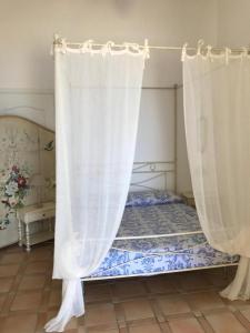 Uma cama ou camas num quarto em Stella d'Argento