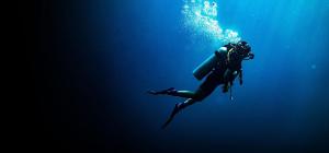 a person in a wetsuit swimming in the water at Antalya Adrenalin in Antalya