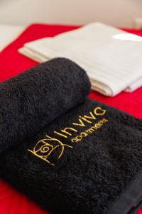 a black towel with the word amazing achievement on it at The Terrace with Acropolis & Athens view in Athens