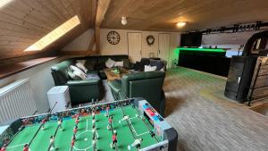 an overhead view of a living room with a pool table at Chalupa Komorský mlýn Holčovice in Stará Komora