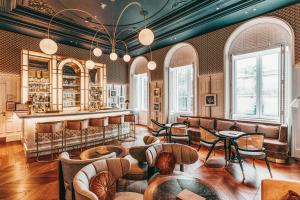 a restaurant with tables and chairs and a bar at Hilton Imperial Dubrovnik in Dubrovnik