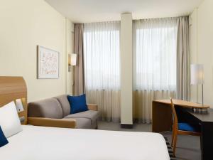 Postel nebo postele na pokoji v ubytování Novotel Budapest Danube
