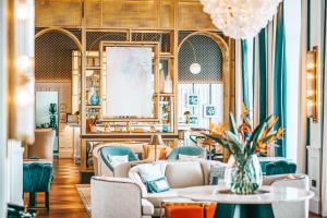 a living room with couches and a table at Hilton Imperial Dubrovnik in Dubrovnik