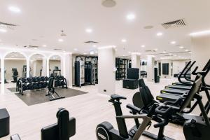 a gym with treadmills and elliptical machines at Hilton Imperial Dubrovnik in Dubrovnik