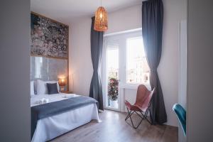 Postel nebo postele na pokoji v ubytování New Elegance Suites Guesthouse