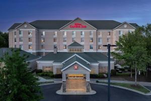 a hotel with a sign on the front of it at Hilton Garden Inn Raleigh Capital Blvd I-540 in Raleigh