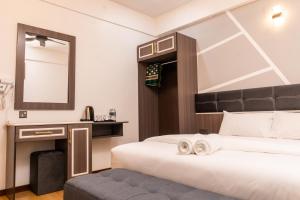 Postel nebo postele na pokoji v ubytování Sunrisestay