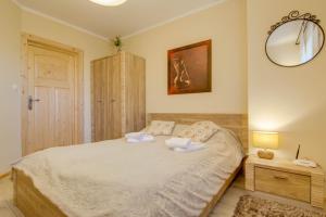 Posteľ alebo postele v izbe v ubytovaní Apartamenty Tatra View Kościelisko