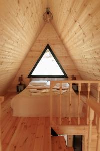 Postel nebo postele na pokoji v ubytování Sno Woodland