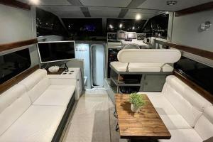 an interior of an rv with a couch and a table at Barco Apartamento Playa Valencia in Valencia