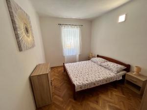 Кровать или кровати в номере Apartments Branko