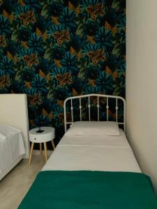 A bed or beds in a room at Casa Ammare