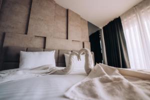 Voodi või voodid majutusasutuse Hotel Aleksandrija toas
