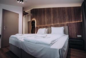 Voodi või voodid majutusasutuse Hotel Aleksandrija toas