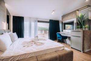 Voodi või voodid majutusasutuse Hotel Aleksandrija toas