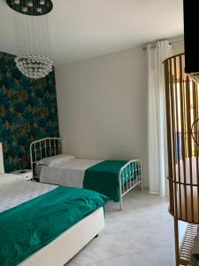 A bed or beds in a room at Casa Ammare