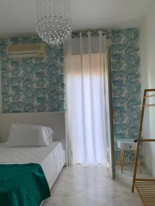 A bed or beds in a room at Casa Ammare