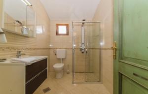 a bathroom with a shower and a toilet and a sink at Villa Melody Novalja in Novalja