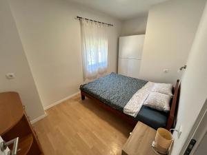 Кровать или кровати в номере Apartments Branko