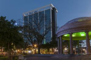 a building and a gazebo in front of a building at Delta Hotels by Marriott San Jose Aurola in San José