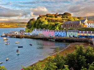 a town with colorful houses and boats in the water at Sithean Beag in Portree