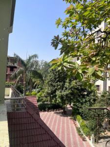 a red roof of a house with a walkway at Kusum Villa in Varanasi