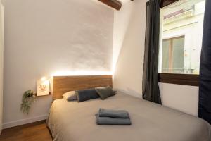 a bedroom with a bed with two pillows on it at Comfy Stay Barcelona Cathedral in Barcelona