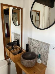 a bathroom with two sinks and a mirror at La Casina del Corral in Cangas de Onís
