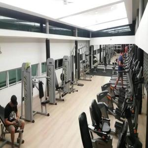 a gym with many rows of chairs and people in it at Kiena Homestay Uuc 2bilik in Kota Kinabalu