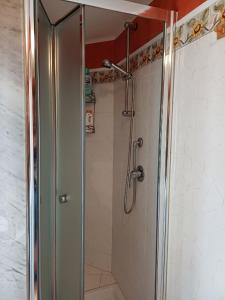 a shower with a glass door in a bathroom at Etnalcantara1 in Castiglione di Sicilia