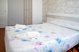 Łóżko lub łóżka w pokoju w obiekcie Casas Rurales Pericón