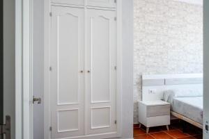 Łóżko lub łóżka w pokoju w obiekcie Casas Rurales Pericón
