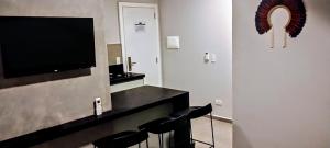 TV a/nebo společenská místnost v ubytování Hotel Coroados Foz Express