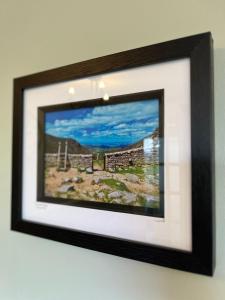 a picture of a picture frame hanging on a wall at Corrigs Retreat in Newcastle