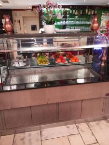 a buffet line with plates of food in a restaurant at La Strada in Murnau am Staffelsee