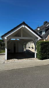 a large white garage with a roof at SONNENSEITE 2 in Laboe
