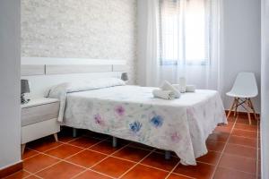 Łóżko lub łóżka w pokoju w obiekcie Casas Rurales Pericón