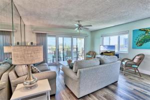 a living room with a couch and a table at Land's End 4-406 Bay Front in St Pete Beach
