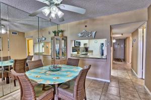 a dining room and kitchen with a table and chairs at Villa Madeira 506 - Premier in St Pete Beach