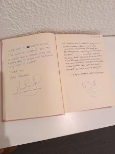 an open book with handwriting on the pages at Sweet House in Lisbon