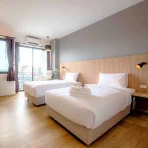 a hotel room with two beds and a balcony at Prime Airport Hotels With Free Shuttle Service in Arnavutköy