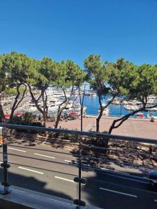 a view of a beach with trees and a road at xGP Track Flat, Up to 14 Guests in Monte Carlo