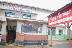 a building with a happy spins hotel and restaurant at Happy Springs Hotel & Accomodation in Kericho