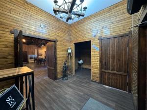 a large room with wooden walls and a wooden floor at SULO Atyrau Hotel in Atyrau +49 photos